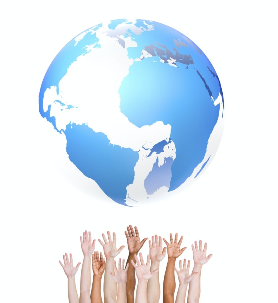 Group of ethnically diverse hands holding up the globe